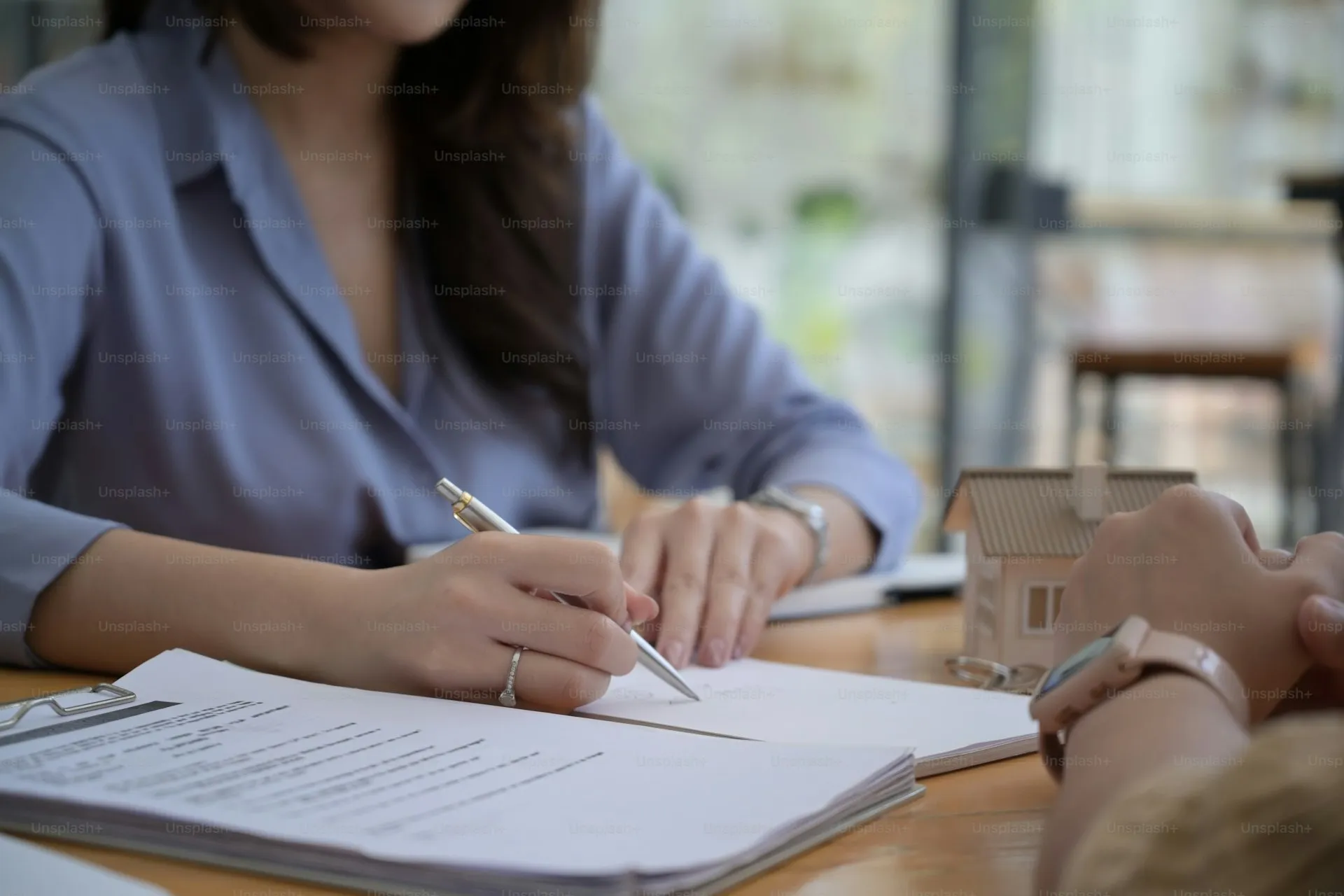 Bank financing certificate document on a desk with apartment keys