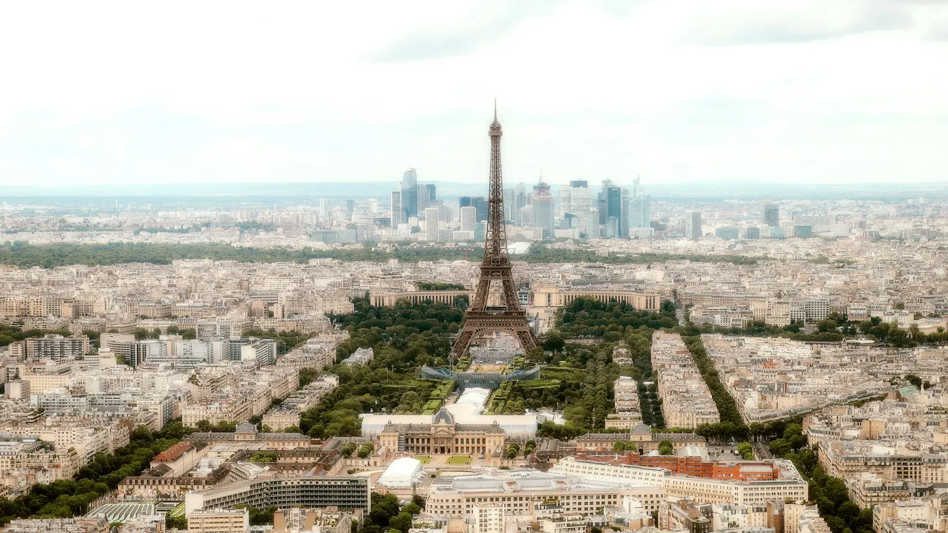 Aerial panorama of Paris with the Seine and Haussmann rooftops at sunset
