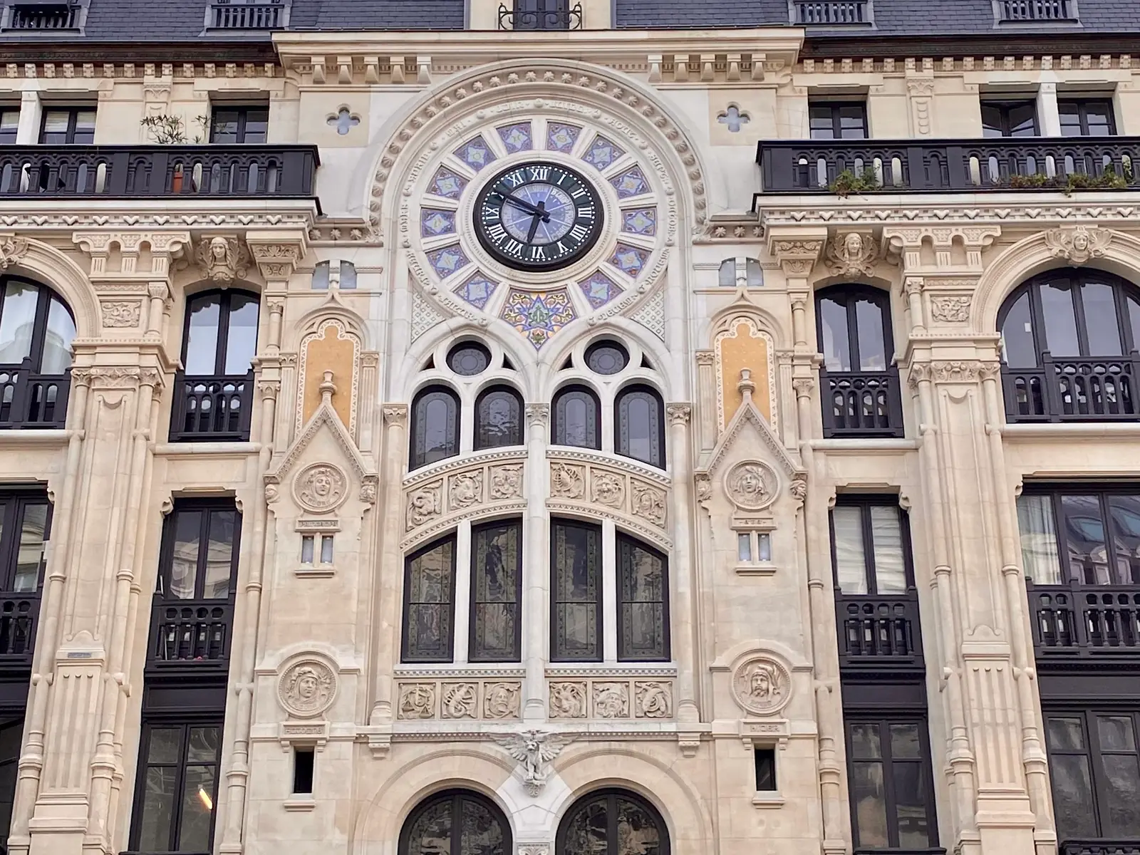 Art Nouveau façade and clock of a Paris building