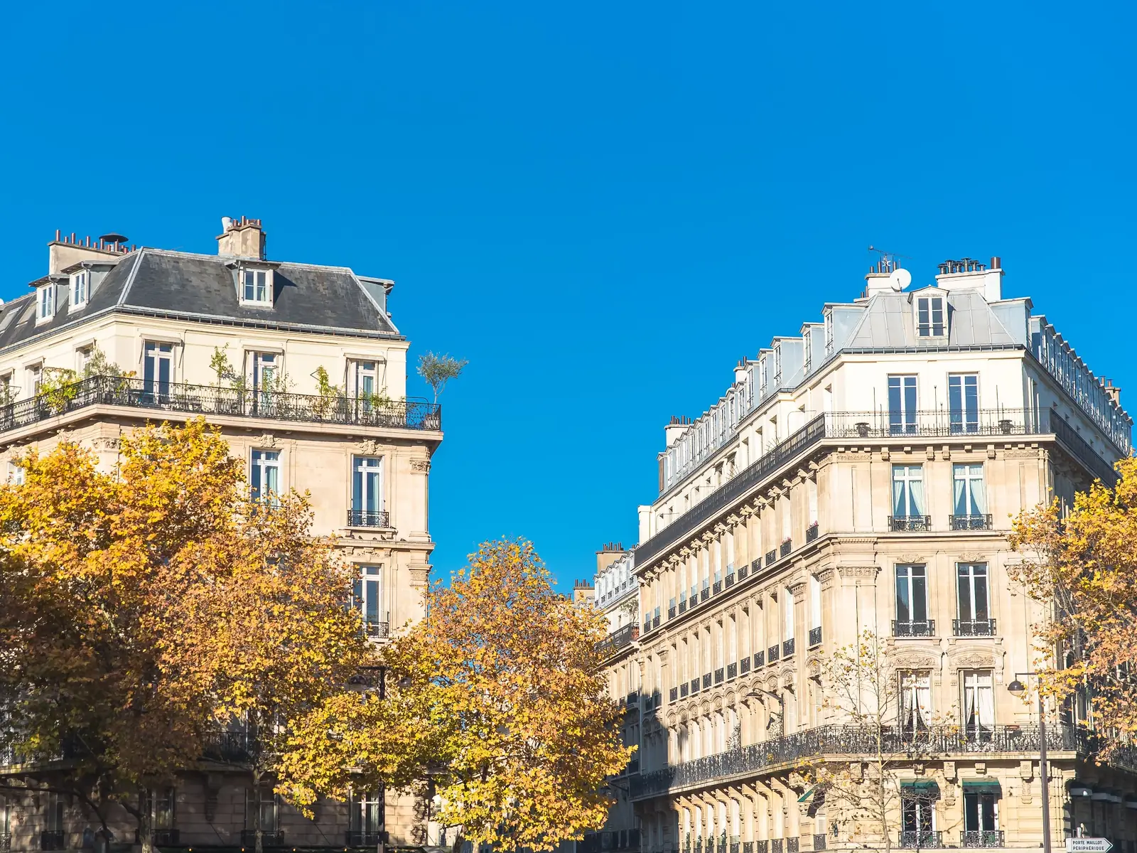 Paris buildings under an autumn blue sky
