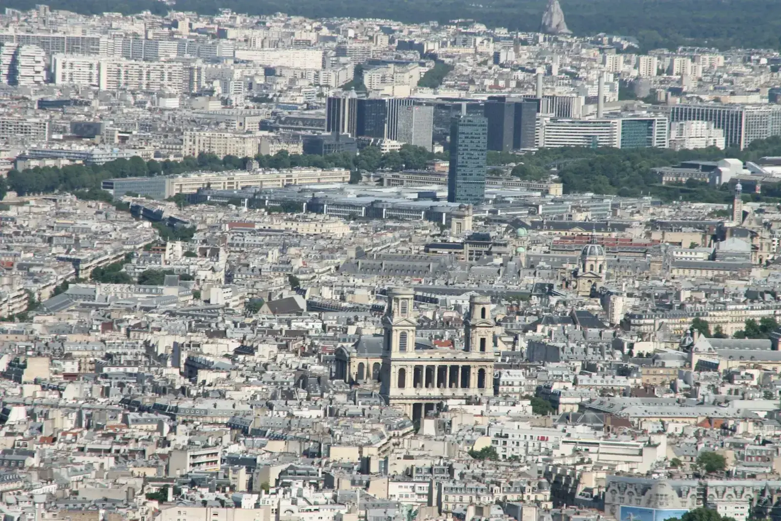Property tax notice placed on a Paris map with a calculator